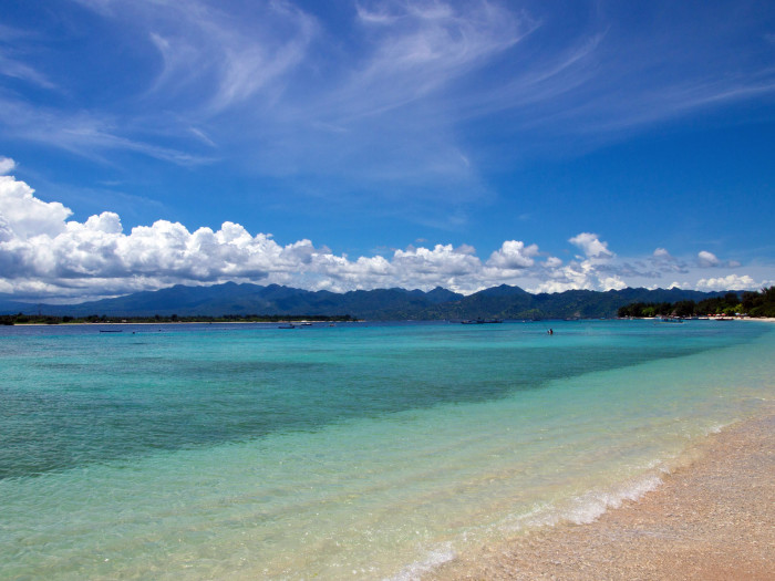 Beach on Gili Trawangan with a view on Gili Meno and Lombok