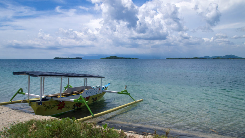 Charter boat and view at Gili Nanggu, Gili Tangkong and Gili Sudak from West Sekotong (Sekotong Barat)