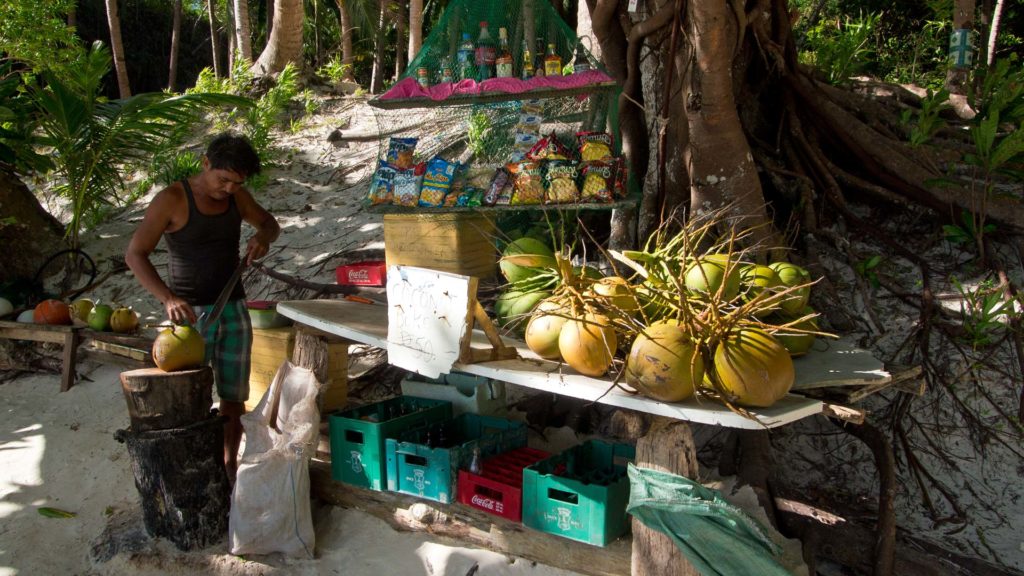 The coconut vendor at Papaya Beach
