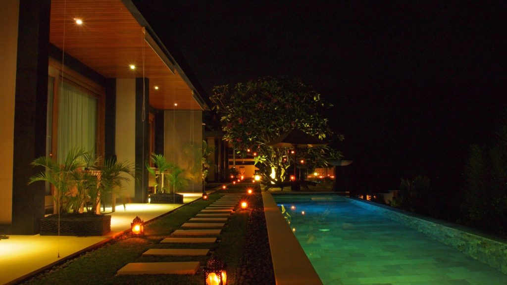 Outside and pool area of The Puncak at night