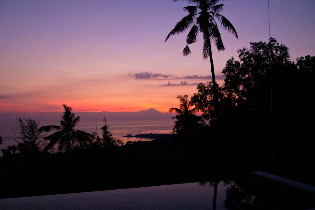An amazing sunset with view at Senggigi Beach and the Mount Agung on Bali
