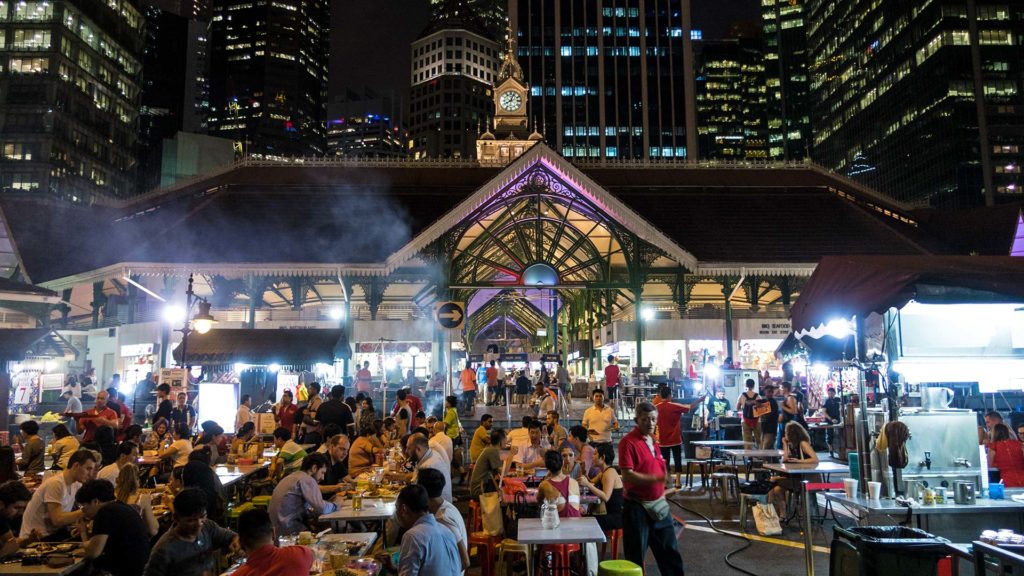 The fascinating Lau Pa Sat Hawker Centre between the skyline of Singapore