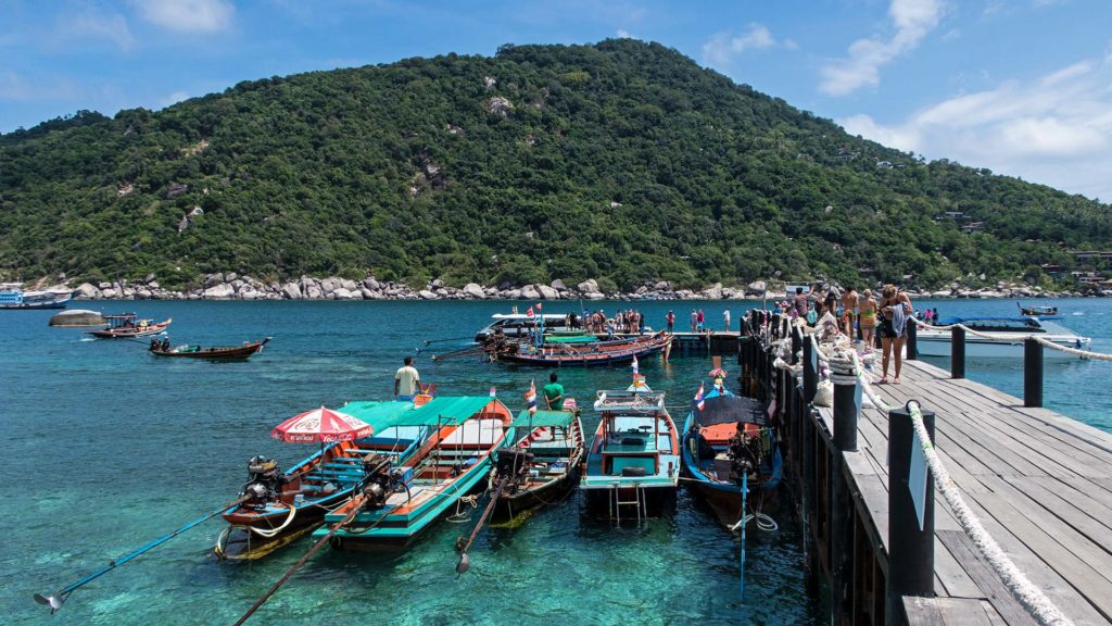 The pier on Koh Nang Yuan with lots of longtail boats