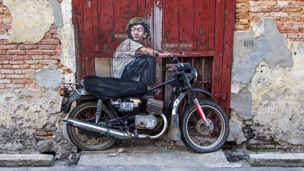 Junge auf dem Motorrad, Streetart in George Town auf Penang