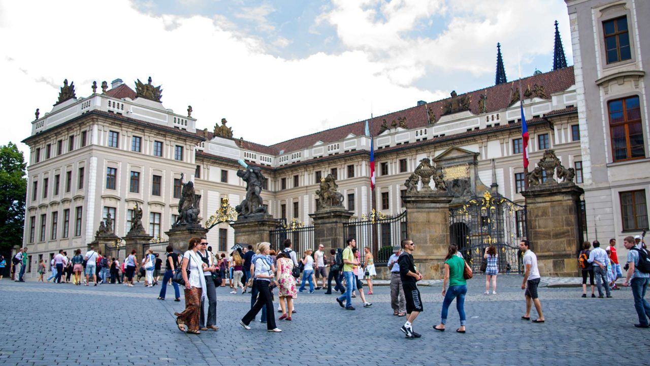 Tourists in front of the Royal Palace of Prague