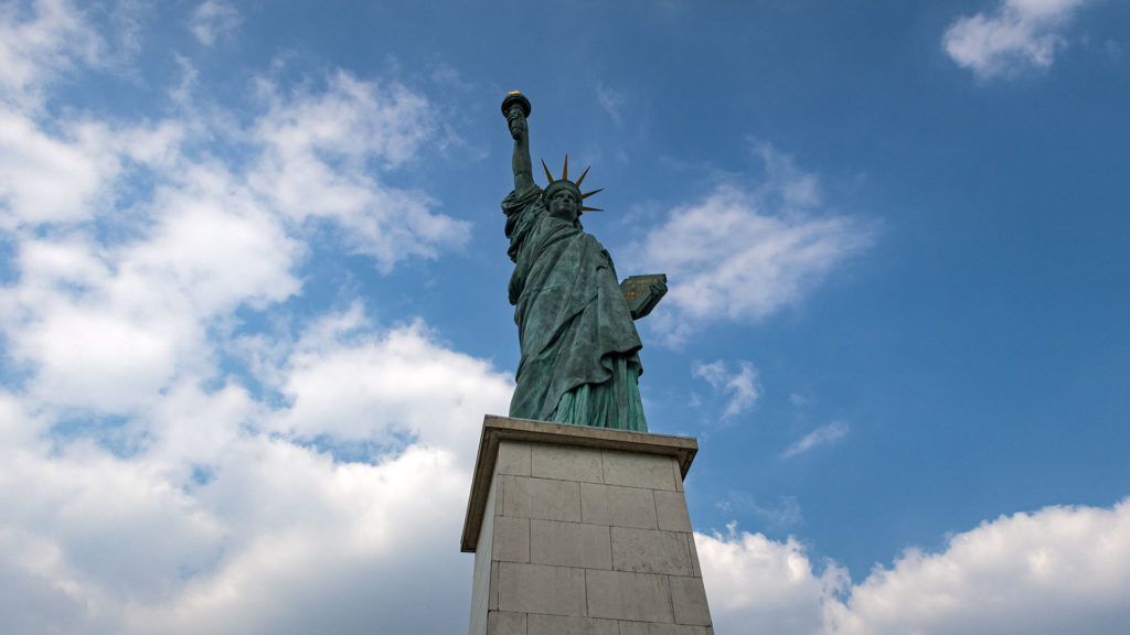 One of the Statue of Liberty replicas in Paris by the Seine River