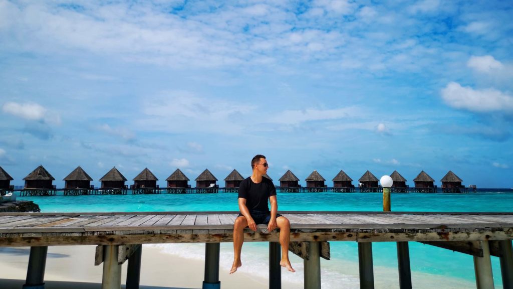 Marcel and the water villas from Thulhagiri Island Resort in the background