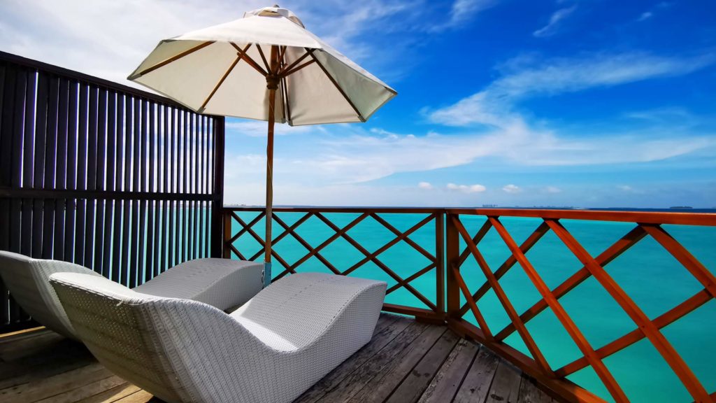 Terrace overlooking the sea in the water villas of Thulhagiri Island Resort