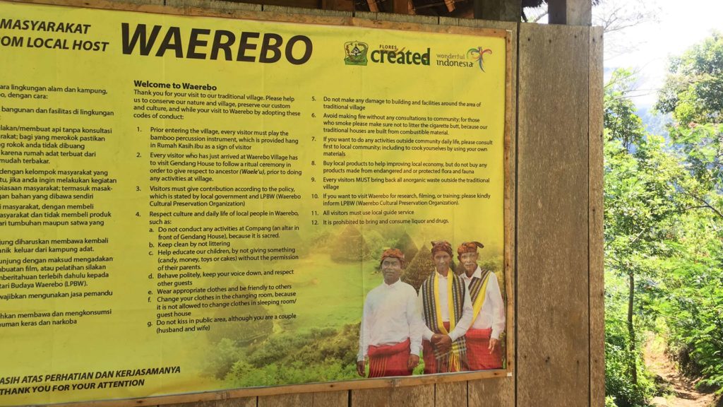 Info board with the rules of conduct in Wae Rebo village