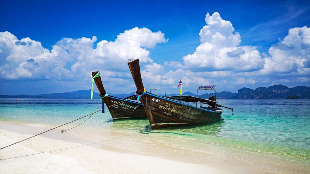 Longtail boat on the beach of Koh Poda during the Krabi 4 Island Tour