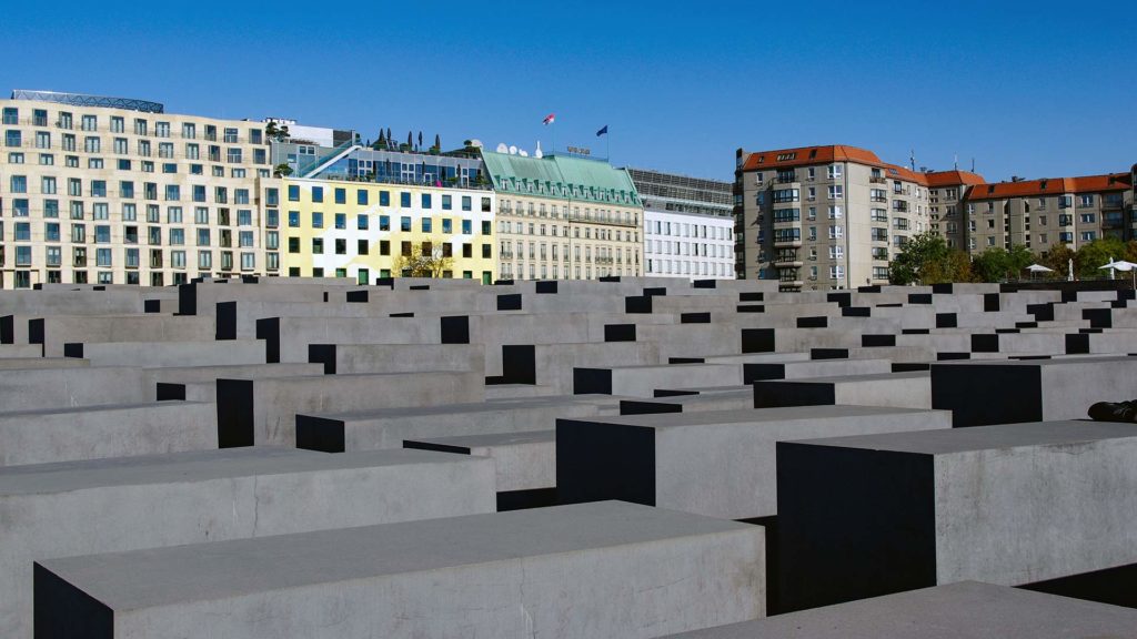 The Memorial to the Murdered Jews of Europe with the Hotel Adlon Kempinski in the background